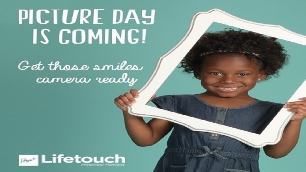 Image of a girl holding an empty picture frame in front of her face as ready for a picture.  Announcement that Picture Day is coming.