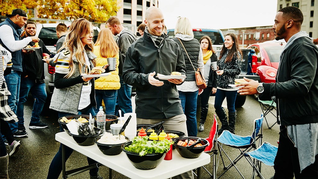 Image of a community coming together and sharing a meal.