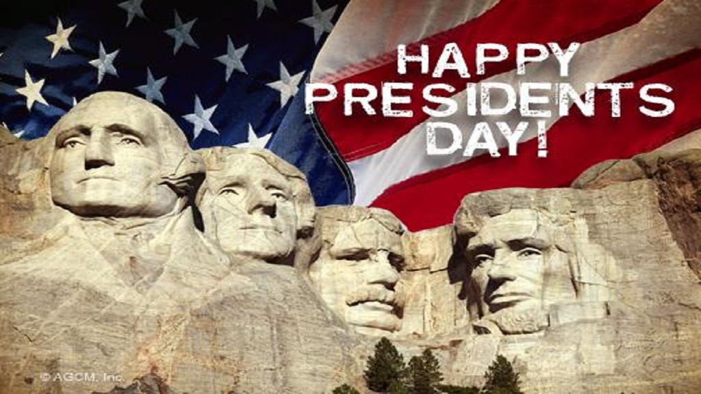 Image of Mt. Rushmore with an American Flag in the background and the words saying: "Happy Presidents Day!"
