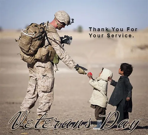 Two boys out in the desert shaking hands with a soldier giving thanks for his service.